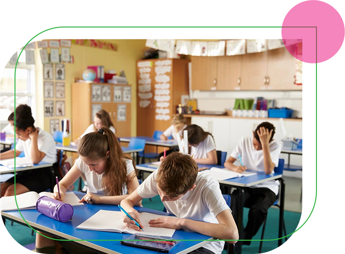 A group of students sitting at desks in a classroom.